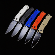 Five open Benchmade folding knives with white, black, blue, orange, and tan handles, displayed on a black background.