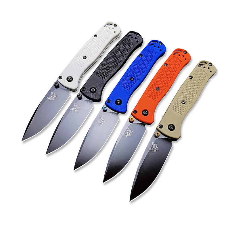 Five open Benchmade folding knives with white, black, blue, orange, and tan handles, displayed on a white background.