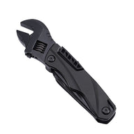 A black folding adjustable wrench with a textured knife-style handle and an exposed adjustment mechanism, shown on a white background.