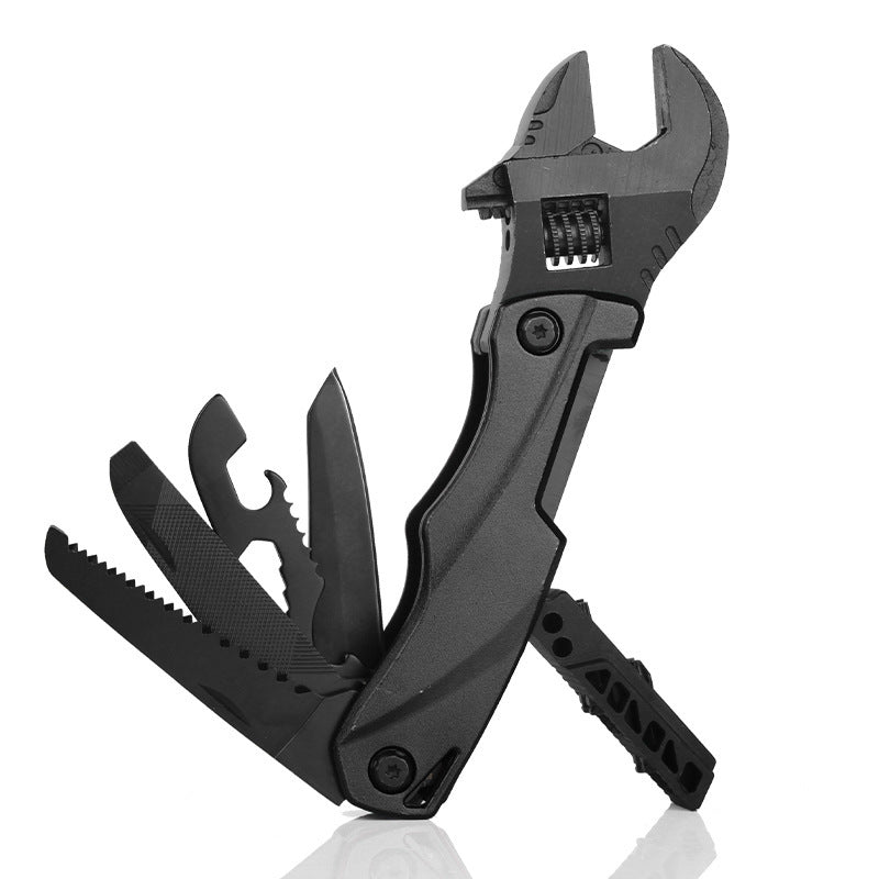 A black folding multi-tool with an adjustable wrench head, featuring several deployed tools including a saw blade, file, and knife, displayed on a white background.