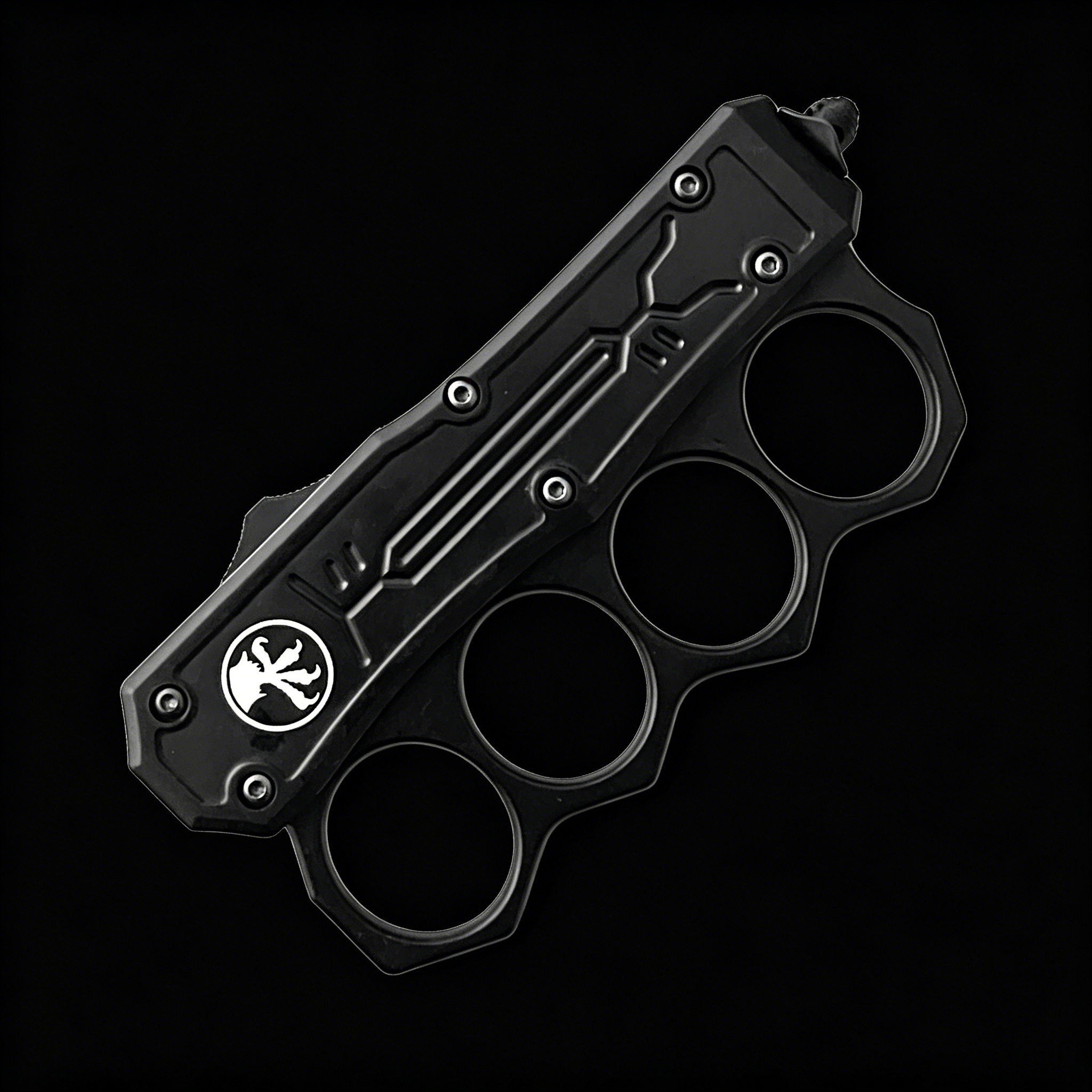A closed black OTF knife with a knuckle duster handle, white logo, and blue screws, displayed on a black background.