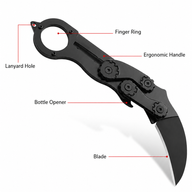 A black mechanical folding karambit knife open on a white background, with red lines labeling its features: Lanyard Hole, Finger Ring, Ergonomic Handle, Bottle Opener, and Blade.