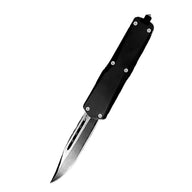 A black OTF knife with a silver blade and hardware, displayed on a plain white background.
