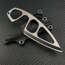 A Böker Plus 440C stainless steel neck knife with a finger ring, resting on its black leather sheath against a dark carbon fiber patterned background.