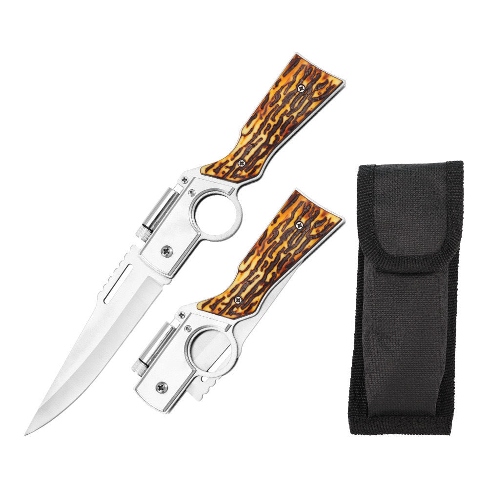 An open and a closed folding knife with silver blades, bone-textured handles, and finger ring frames, shown next to a black nylon sheath on a white background.