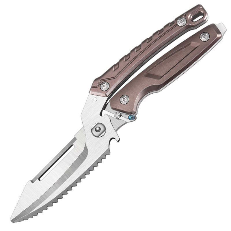 An open tactical folding knife with a brushed silver blade featuring serrated edges and a groove, paired with a bronze skeletonized handle and a blue pivot accent, displayed on a white background.