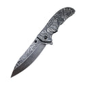 An open folding knife with intricate engravings of a deer, a wolf, and mountain landscapes on the blade and handle, displayed on a white background.