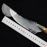 A curved feather blade knife displayed on a dark background with a metal ruler and a plastic protractor to show its dimensions and blade angle.