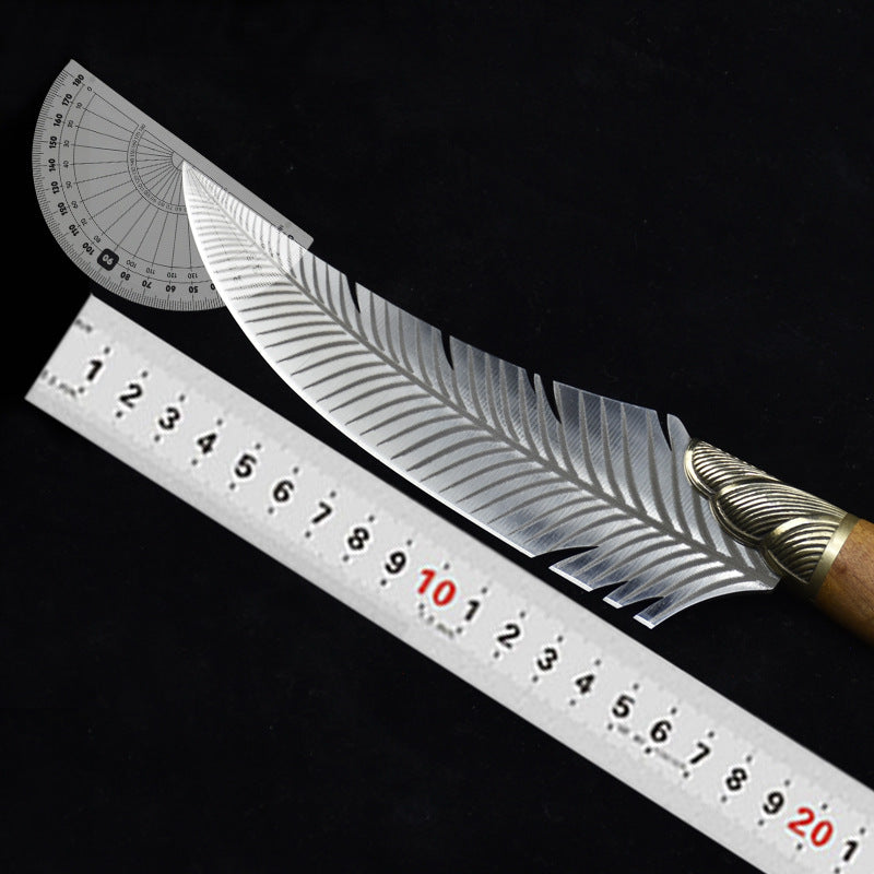 A curved feather blade knife displayed on a dark background with a metal ruler and a plastic protractor to show its dimensions and blade angle.