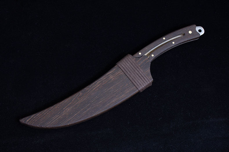 A full view of the dark wooden sheath for the feather blade knife, showing the wrapped cord and matching wood grain.