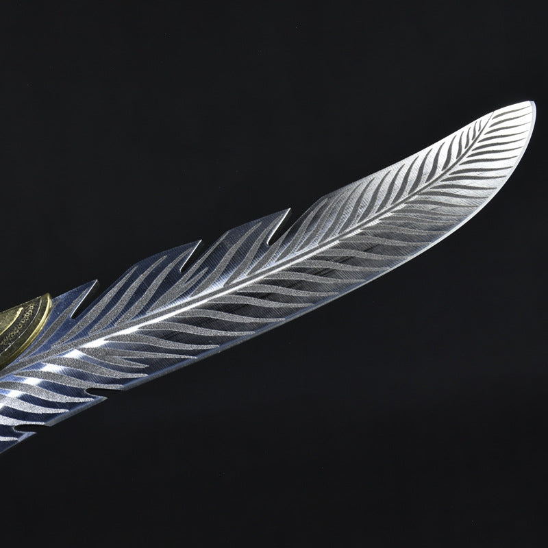 A macro shot showing the unique feather-like serrations and detailed engraving along the edge of the silver blade.