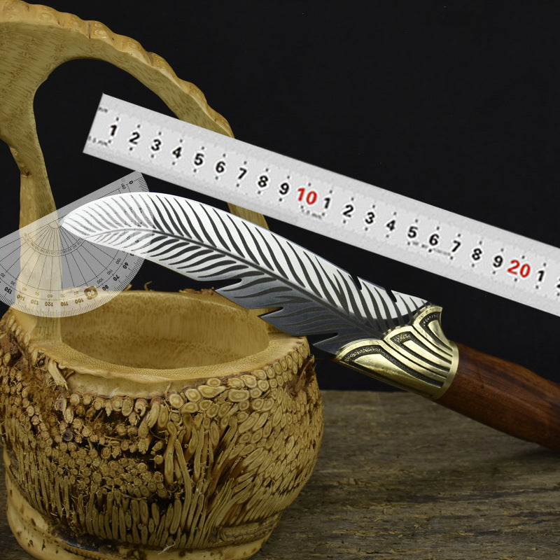 A feather-patterned fixed blade knife displayed on a dark background with a metal ruler and a plastic protractor to show its dimensions and blade angle.