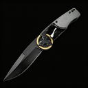 An open tactical folding knife with a black blade, dark grey handle, and a distinctive gold gear pivot mechanism, displayed on a black background.