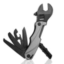 A folding adjustable wrench multi-tool with a grey handle and black tools deployed, displayed on a white background with a reflection.