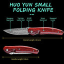 A product specifications graphic for the HUO YUN Small Folding Knife, featuring a Damascus steel blade and rosewood handle. The black background infographic displays the knife in both open and closed positions, highlighting features such as a 60 HRC hardness, overall length of 16.5cm, and handle length of 9.6cm.
