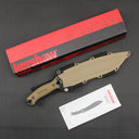A sheathed Kershaw fixed blade knife with a tan handle and molded sheath, displayed with a red and black packaging box and a product manual on a dark textured surface.