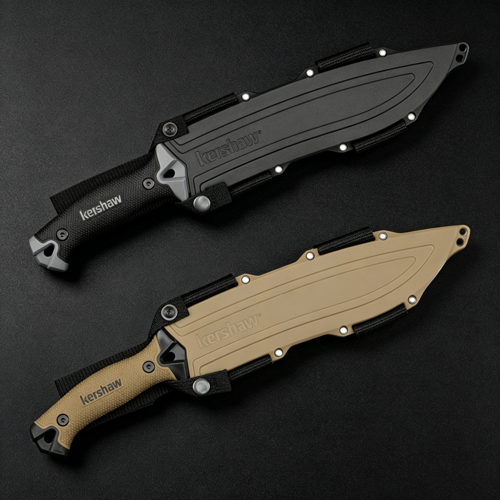 Two Kershaw fixed blade knives with textured handles and molded sheaths; the top knife is black and the bottom knife is tan, displayed on a dark surface.