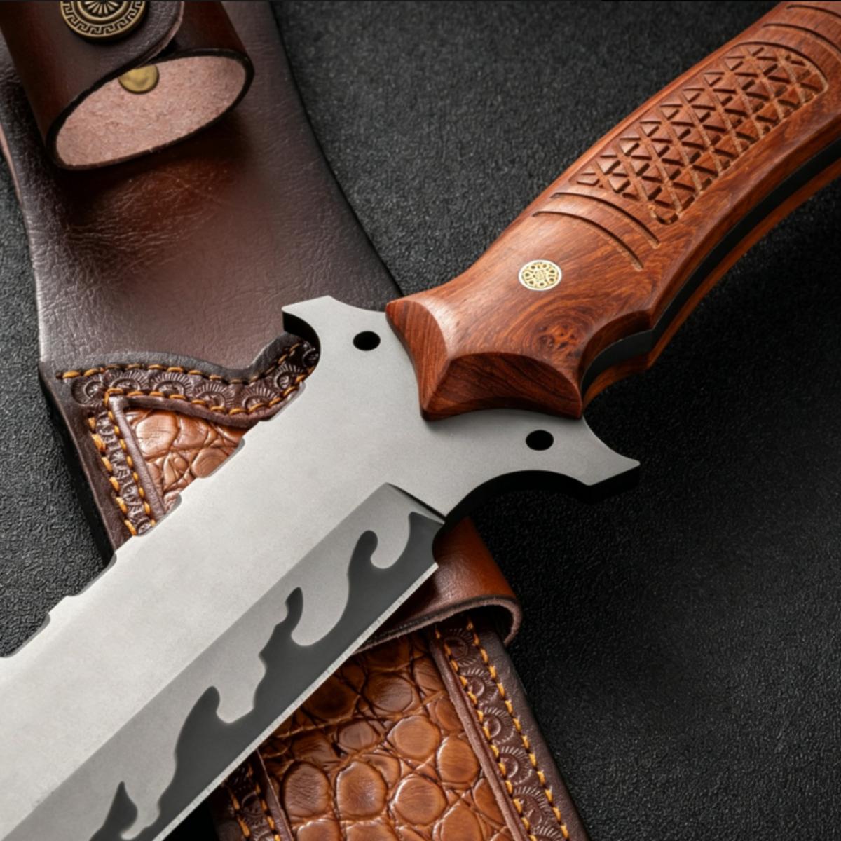 A close-up of the serrated edge of a custom knife blade with black flame patterns, displayed over a textured brown leather sheath.