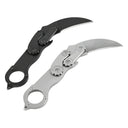 Two open mechanical folding karambit knives with a finger ring handle and gear mechanism, one black and one silver, displayed on a white background.