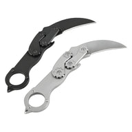 Two open mechanical folding karambit knives with a finger ring handle and gear mechanism, one black and one silver, displayed on a white background.