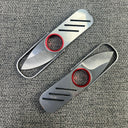 An open and a closed silver metal keychain folding knife lying flat on a grey textured surface, highlighting the ultra-thin design.