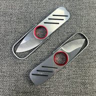 An open and a closed silver metal keychain folding knife lying flat on a grey textured surface, highlighting the ultra-thin design.