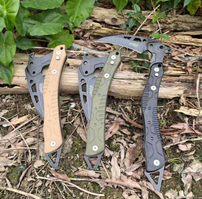 Sand, olive green, and black tactical multi-purpose breaching tools displayed horizontally, clearly showcasing their distinctive curved blades and skeletonized handle design.