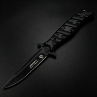 An open Noks folding knife with a black textured handle and a silver blade, displayed on a dark background.