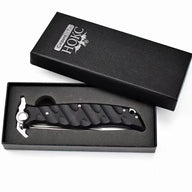 A Noks folding knife inside its black presentation box, displayed on a white background.