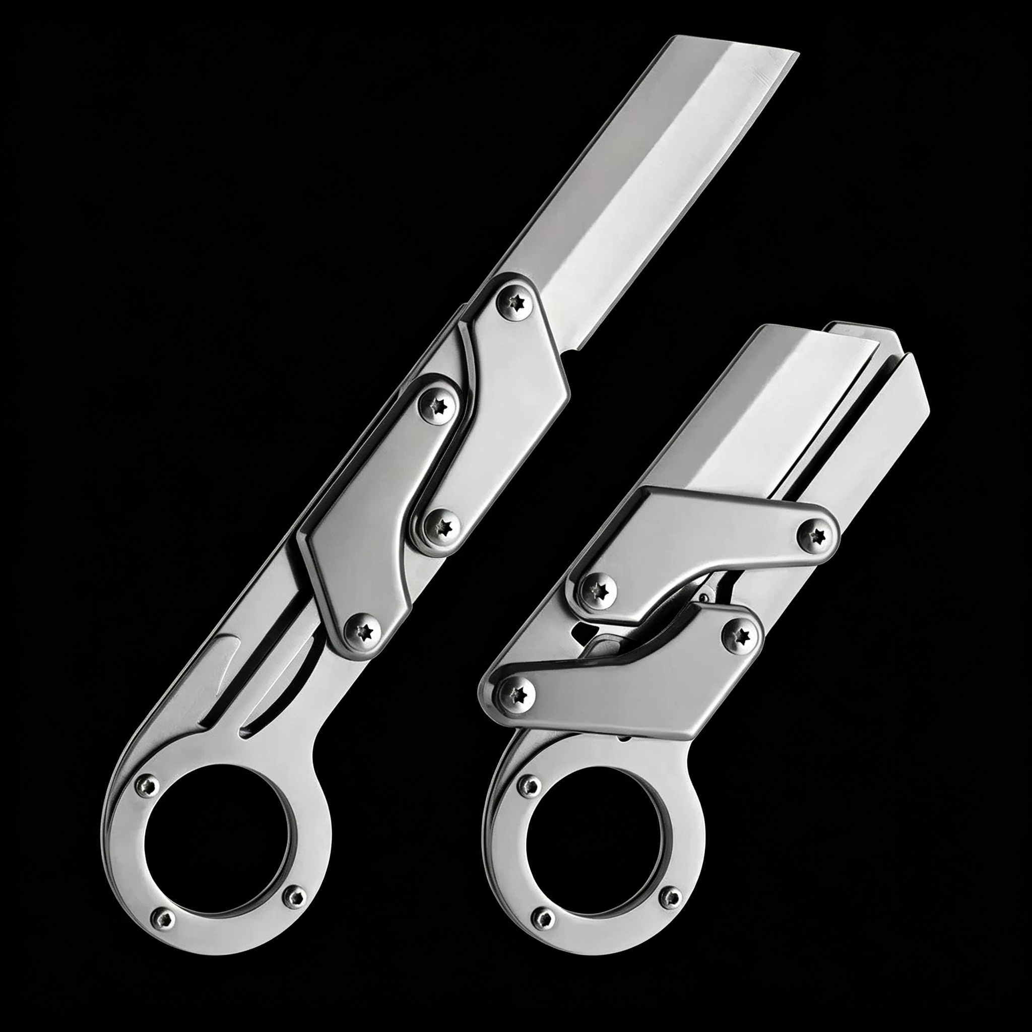 Two silver folding knives with a ring handle, mechanical linkage design, and a grooved blade, shown open and closed on a black background.