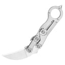 An open silver mechanical folding karambit knife with a ring handle, visible gear mechanisms, and a curved blade, displayed on a white background.