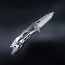 A closed tactical folding knife with a silver skeletonized handle, visible screws, and a pocket clip, displayed on a dark background.
