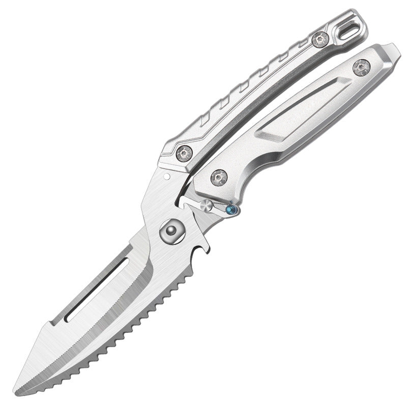 An open silver folding knife with a skeletonized handle and a serrated blade featuring a groove, displayed on a white background.