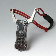 A silver stainless steel EDC slingshot with a red band and steel ball storage, displayed on a white background.