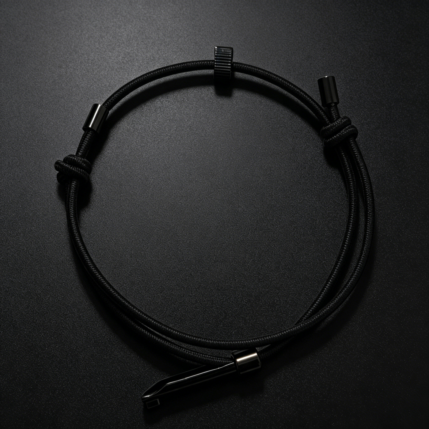Survival wrist strap emergency glass breaker with tungsten alloy impact bead, adjustable elastic strap, and handcuff key for quick vehicle escape and emergency use.
