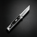 An open tactical folding knife with a grey handle and black insert, displayed on a dark background.