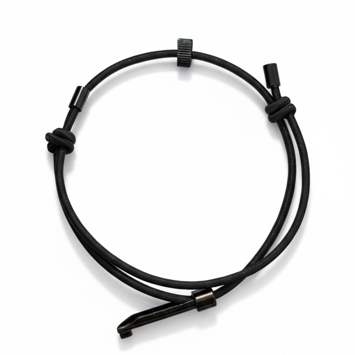 A clear product shot of a black wearable tactical handcuff key with an adjustable loop, knot details, and a metal key insert, on a white background.