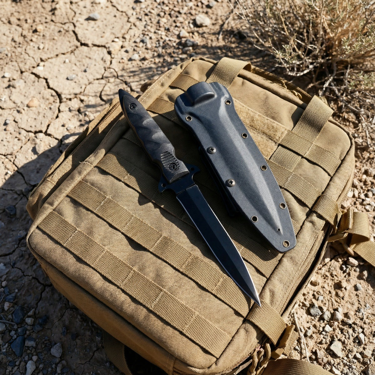 Black tactical double-edged fixed blade knife with an all-black finish, featuring a non-slip cross guard and tactical Kydex sheath, displayed on an outdoor tactical backpack to showcase its rugged outdoor style.