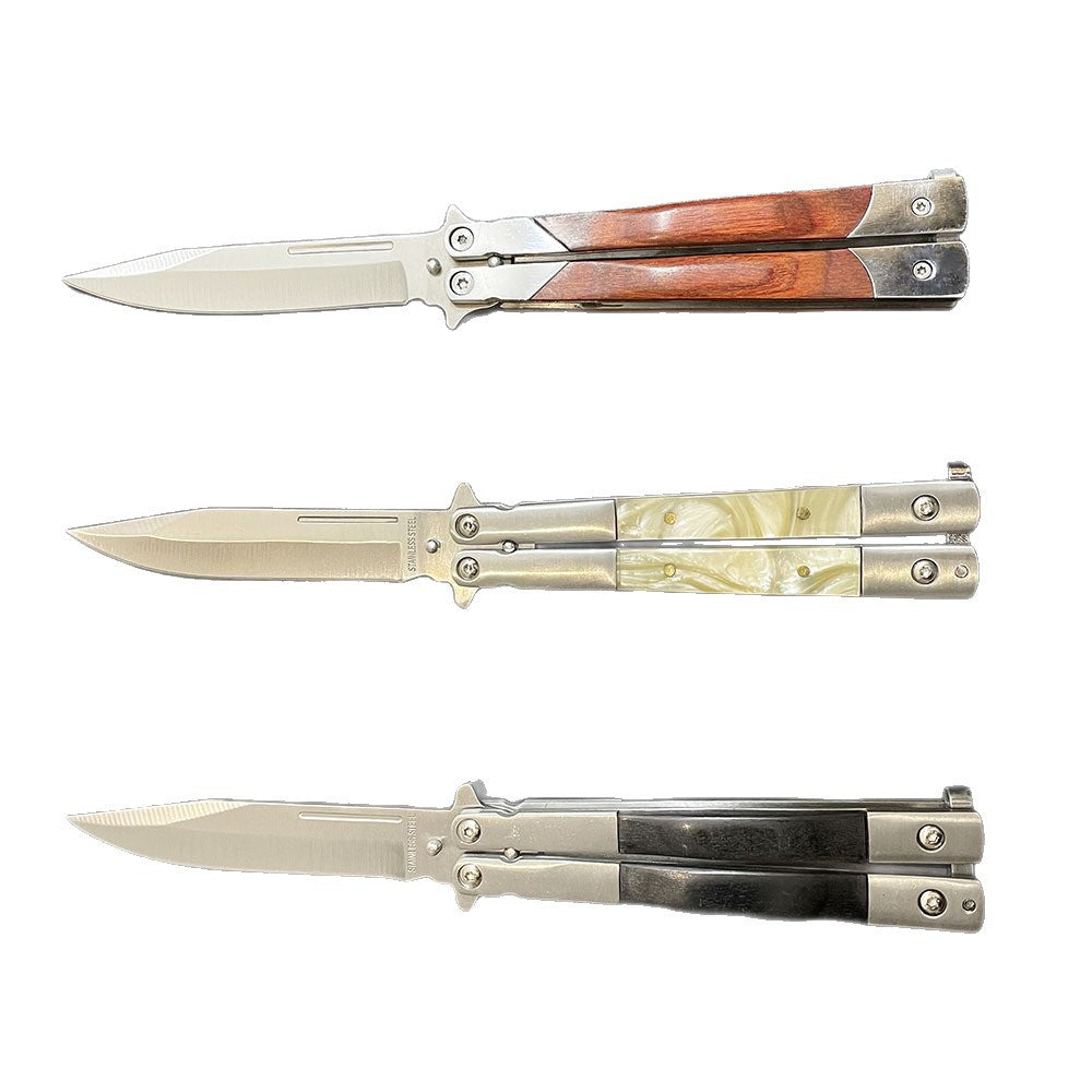 Three open balisong butterfly knives with silver blades and wooden, pearl, and black handles, displayed horizontally on a white background.