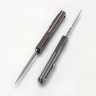 Two open out-the-front knives with slim blades, one with a grey handle and one with a bronze handle, displayed on a white background.