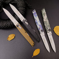 Two open and two closed folding knives arranged diagonally on a dark leather surface next to a thick rope and dried autumn leaves.