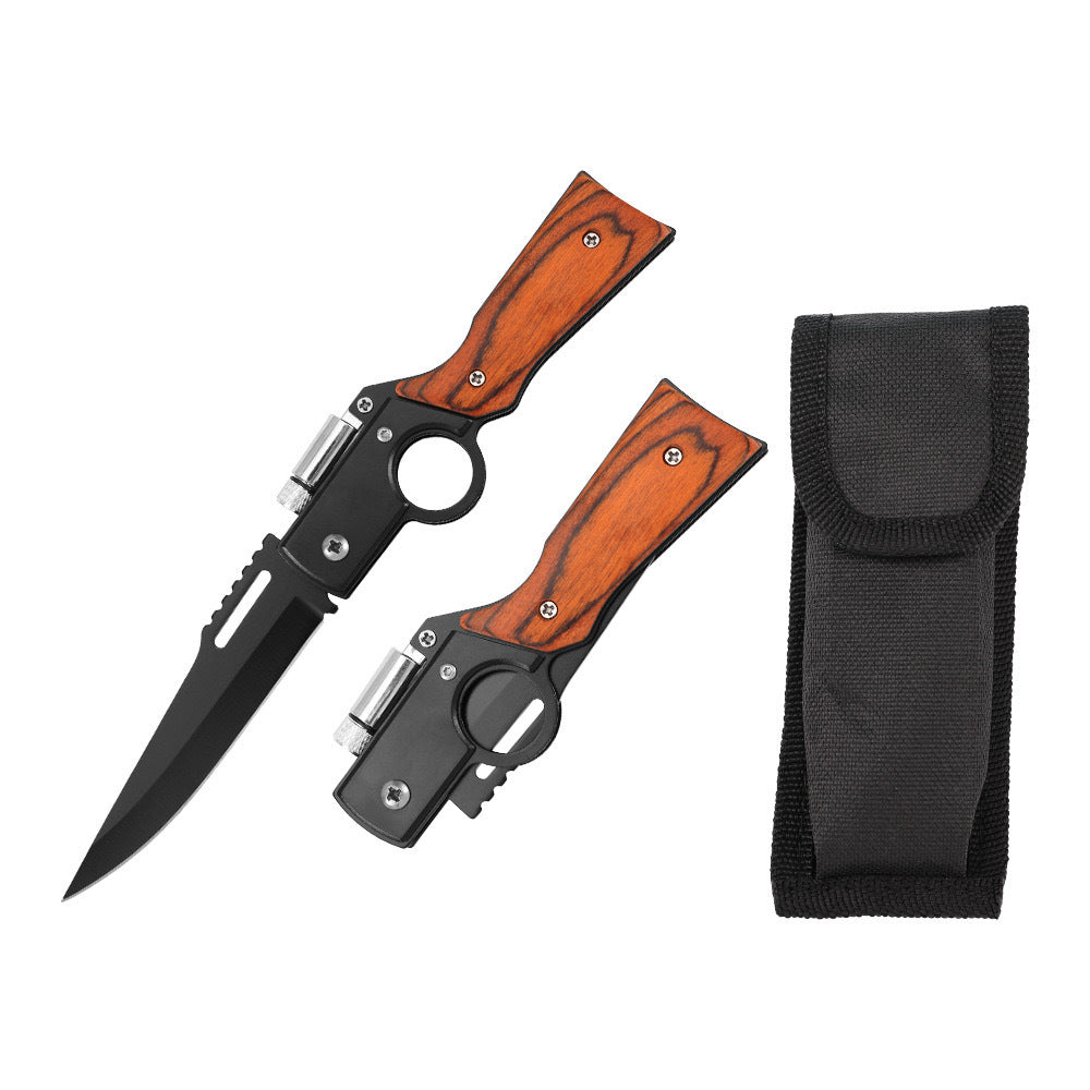 An open and a closed folding knife featuring black blades, wooden handles, and black finger ring frames, displayed next to a black nylon sheath on a white background.